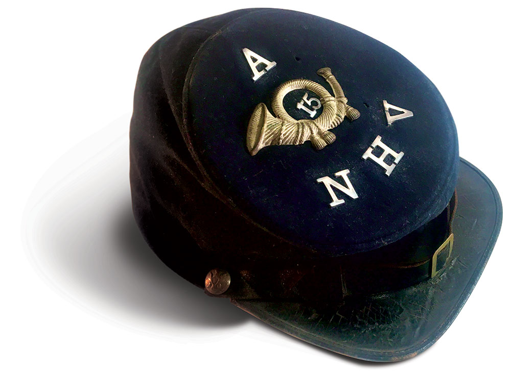 This cap belonged to Cpl. John C. Blake, who served in the 15th from October 1862-August 1863. He is pictured below with the same cap. This wartime portrait appeared in the regiment’s 1900 history. Blake died in 1908.