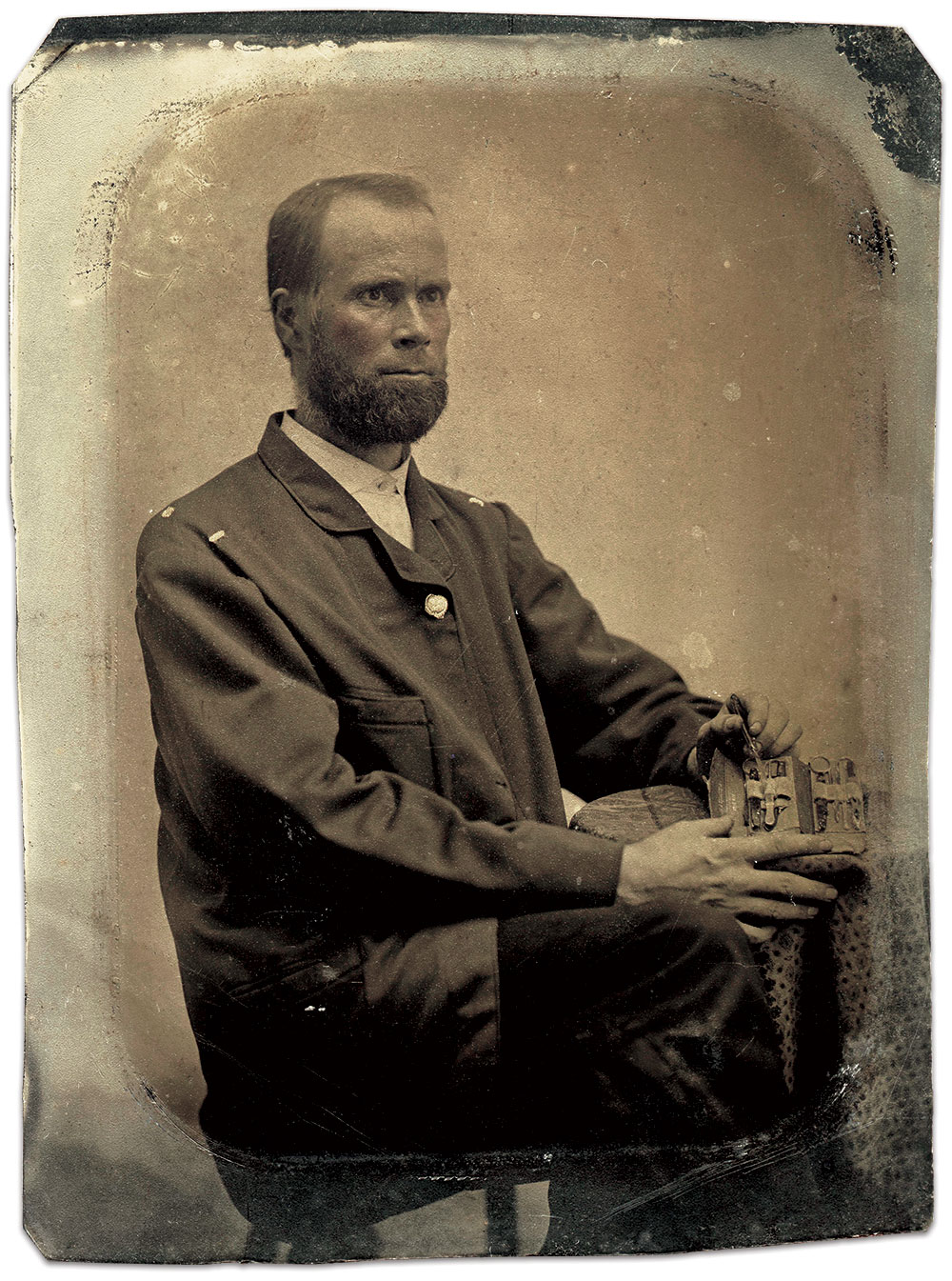 John Gore Johnson displays his surgical kit in this quarter-plate tintype attributed to Mr. Wallace.  The note below was found tucked behind it. Paul Russinoff Collection.