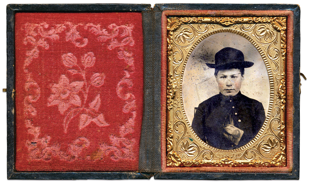 This Union soldier, his youth suggestive of a drummer boy, poses with a $1 United States Demand Note, series of Aug. 1, 1862, stuffed in the open breast of his coat. Ninth-plate tintype by an anonymous photographer. Author’s Collection.      