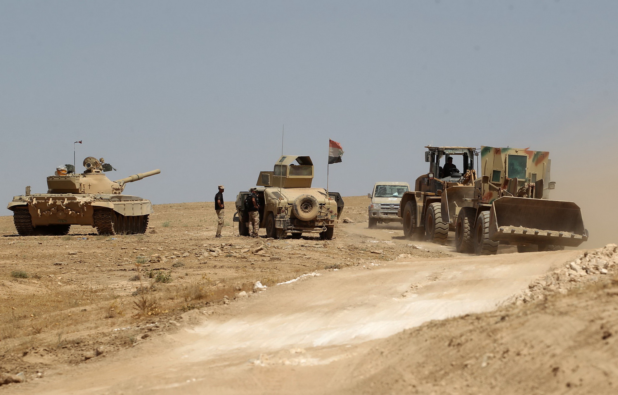 Các lực lượng Chính phủ Iraq tiến vào Tal Afar trong chiến dịch giải phóng thành phố này khỏi phiến quân IS ngày 21/8. (Nguồn: AFP/TTXVN)