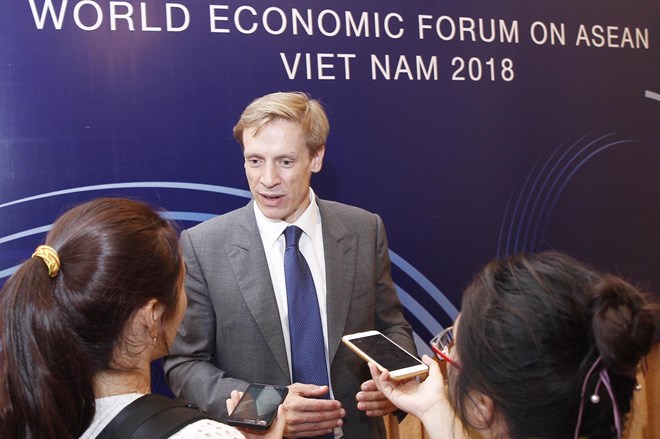 Justin Wood, Head of Asia Pacific and Member of the WEF Executive Committee answers reporters (Photo: VNA)