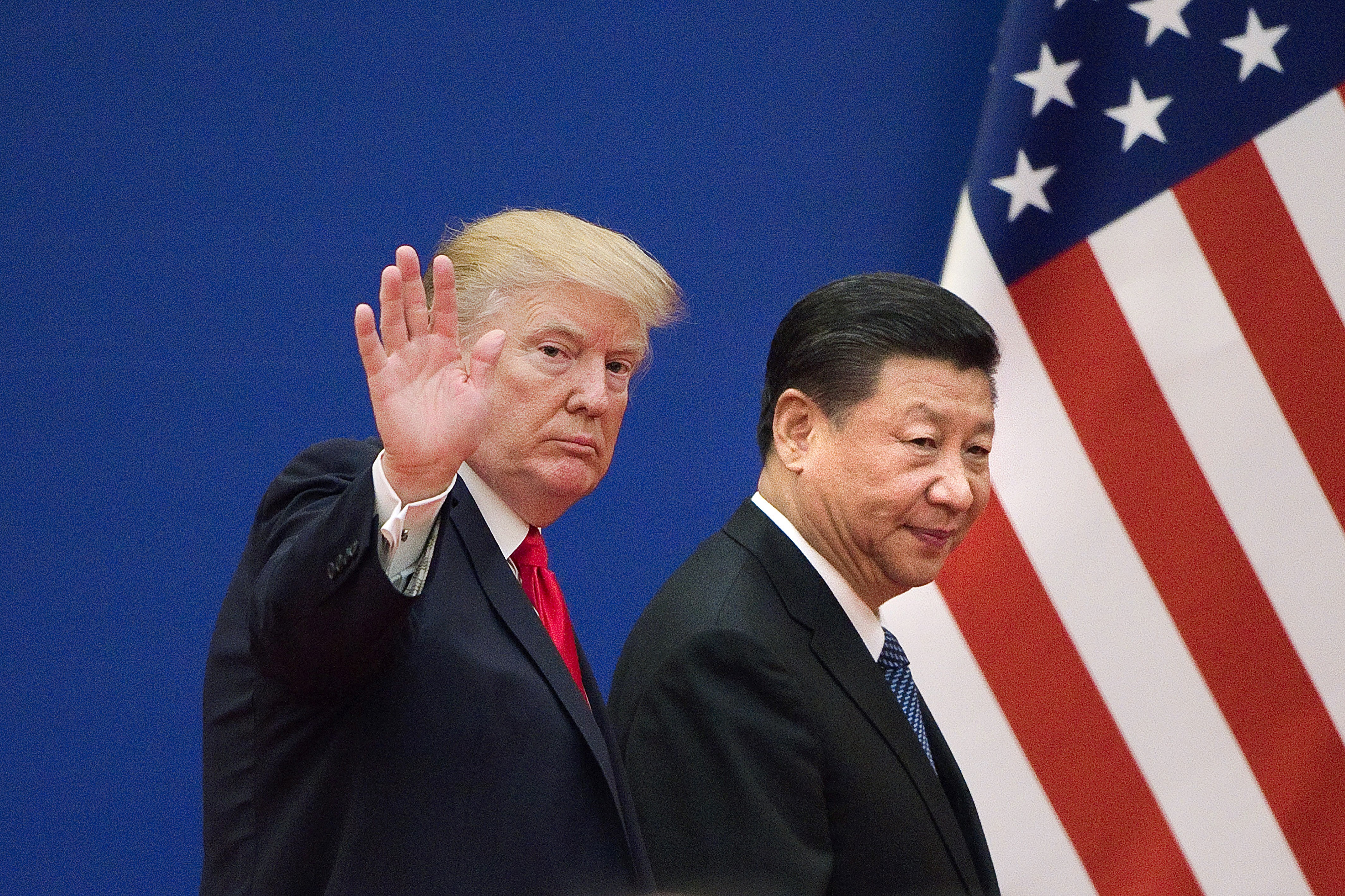 Tổng thống Mỹ Donald Trump (trái) và Chủ tịch Trung Quốc Tập Cận Bình trong cuộc gặp tại Bắc Kinh (Trung Quốc). (Ảnh: AFP/TTXVN)